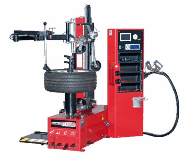 Reifenmontiermaschine Reifenmontiermaschine in roter Ausführung mit montiertem Autoreifen. Die Maschine verfügt über mehrere mechanische Arme, eine Steuereinheit mit Display und Bedienelementen sowie integrierten Stauraum für Werkzeuge.